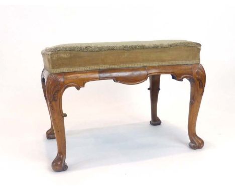 An 18th century-type walnut and upholstered stool with shell-capped cabriole legs CONDITION REPORT: Height 76 cm. Not suitabl