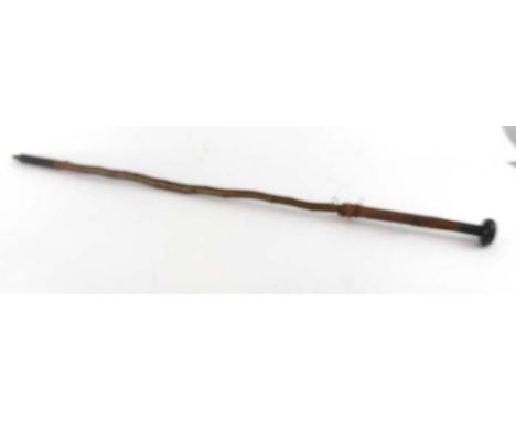 *AMENDED DESCRIPTION*A makila shepherds stick with leather handle, ebonised pommel and metal bound base