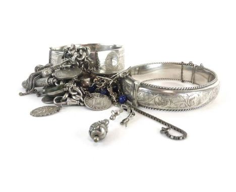 A mixed parcel of silver including an engine turned cigarette case, four bracelets, a charm bracelet and other items of jewel