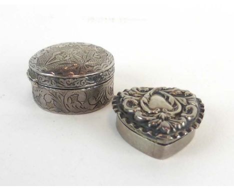 A late Victorian repousse decorated silver pill/patch box of heart shaped form, maker A&L Ltd., Birmingham 1899, w. 3 cm, tog