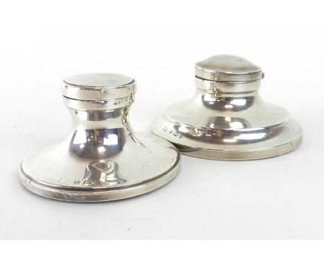 An Edwardian silver capstan-type inkwell of typical form, Birmingham 1912, d. 8 cm, together with a similar inkwell, smaller 