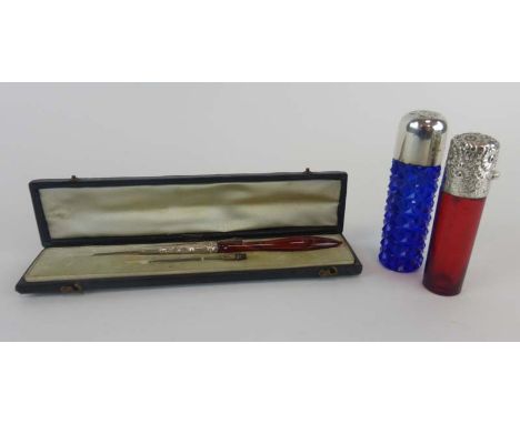 A Bristol blue glass scent bottle with silver mounts, h. 8 cm, another ruby glass scent bottle with metalware mounts and a ca