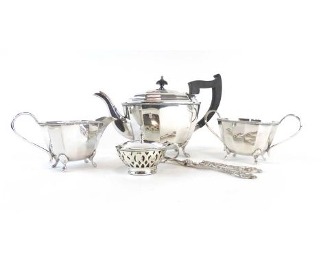 A small group of silver plated items comprising a three piece tea service, a mustard, a funnel and a pair of grape scissors (