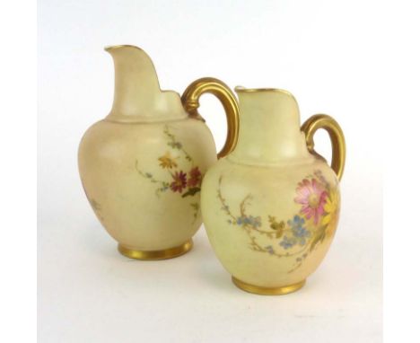 A graduated pair of Royal Worcester ivory blush cream jugs, typically decorated with floral sprays, max h. 13 cm CONDITION RE