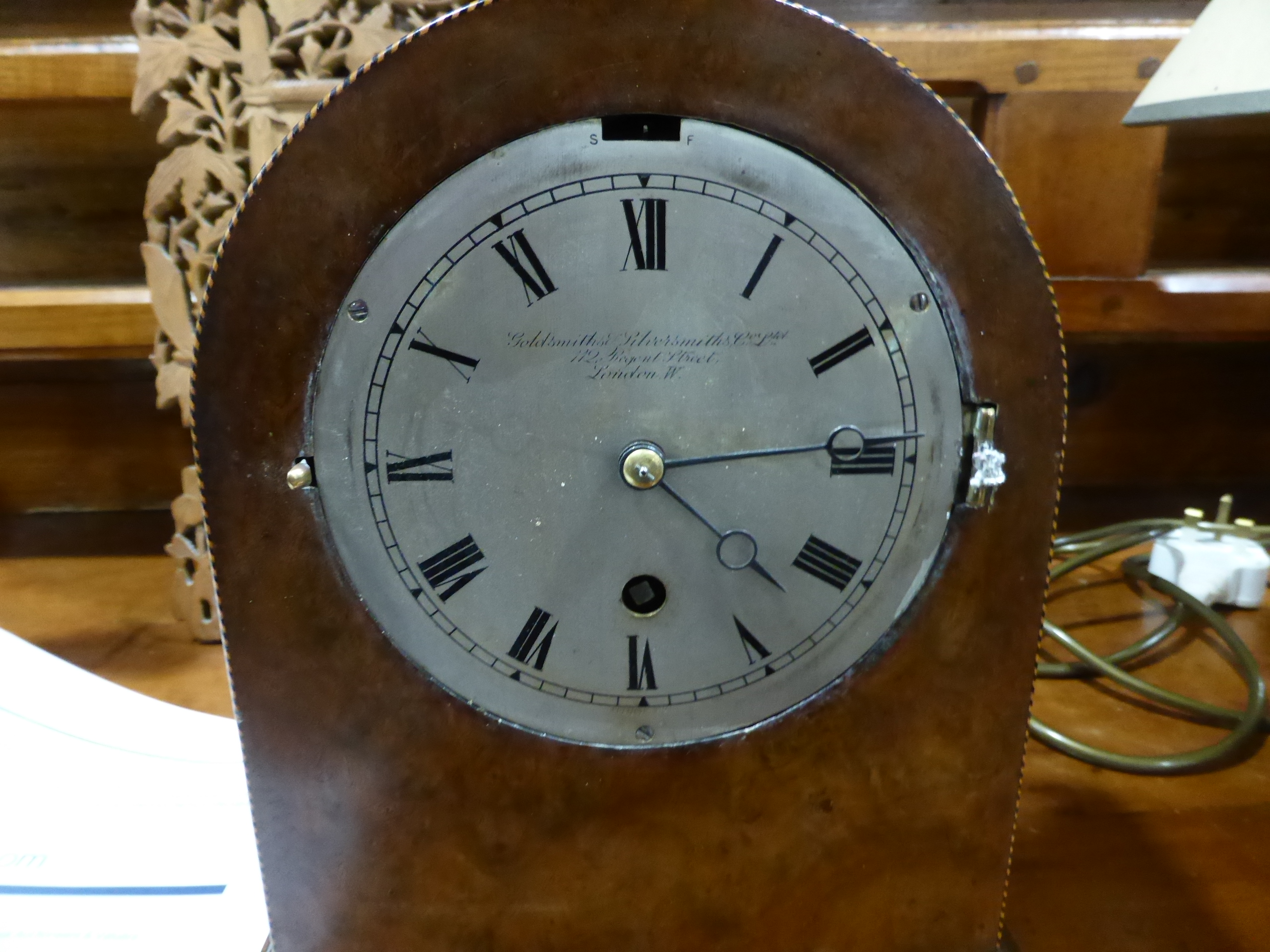 A late 19th century mantel clock by Goldsmiths and Silversmiths Co. Ltd of London, the silvered d