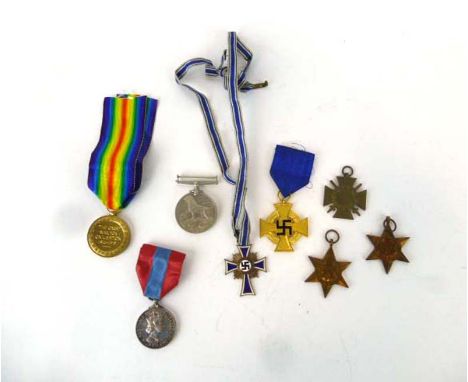 A group of medals including a First World War Victory Medal awarded to 3-11192 Pte. T.J. Marcon Northamptonshire Regt., a cas