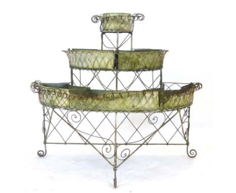A 20th century galvanised and metalwork three tier garden planter of semi-circular form
