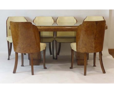 Attributed to Harry and Lou Epstein, an Art Deco walnut dining suite including a twin-pedestal table, a sideboard and six 'Cl