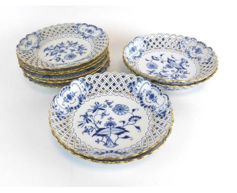 A set of four Meissen ribbon edge plates decorated in the onion pattern, d. 24 cm, together with six matching cabinet plates 