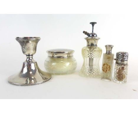 A silver dwarf candlestick, h. 9.5 cm and four silver mounted dressing table bottles, various dates and makers (5) CONDITION 