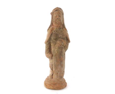 A Tang Dynasty painted pottery figure modelled as a standing soldier, his hand resting on his shield, h. 43 cm*see Lot 205 So