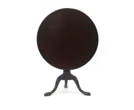 A George III mahogany supper table, the circular tilt-top over a turned column and tripod base, d. 75 cm CONDITION REPORT: St