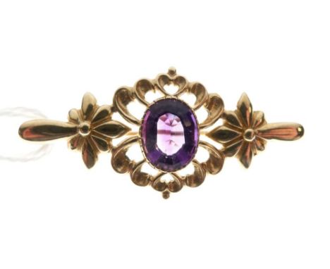 Unmarked yellow metal brooch set amethyst-coloured stone, 4.4cm wide, 5.2g gross approx  
