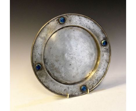 Early 20th Century Arts &amp; Crafts-style planished pewter dish of circular form with Ruskin-style ceramic roundels, 27cm di