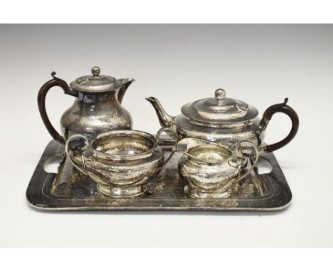 Early 20th Century Arts &amp; Crafts-style planished pewter tea service, the hot water jug 17.5cm high, the tray 42cm wide, s