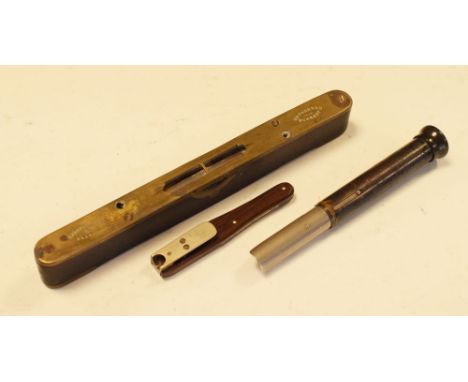 Early 20th Century pocket microscope, focusing via retractable barrel, together with a quill cutter with belt clip and spirit