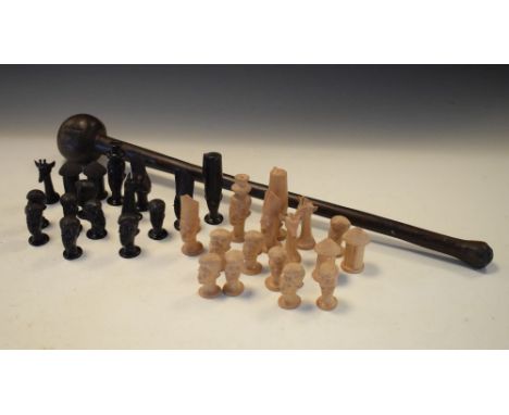 African carved wooden chess set, natural and stained, comprising figures, giraffes, huts etc, Kings 8cm high, together with a