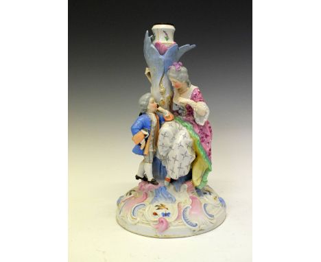Early 20th Century Continental porcelain figural lamp base modelled with a seated mother and young child on scroll moulded ba