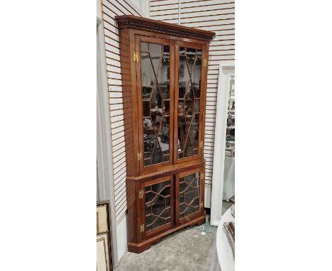 19th century mahogany floor standing corner display cabinet with dentil cornice, the top with two serpentine shelves, the bas