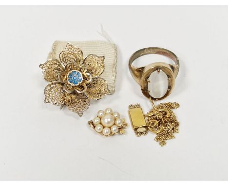 Gold coloured ring with moonstone chatoyancy, a gold coloured flower shaped brooch with blue enamel to centre, marked 835,&nb