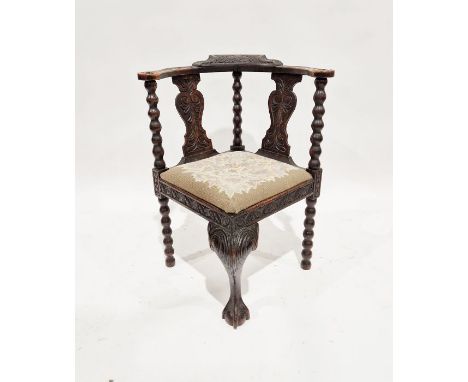 Carved and stained oak corner armchair with foliate carved bow top rail and twin splat-back, woolwork tapestry drop-in seat&n