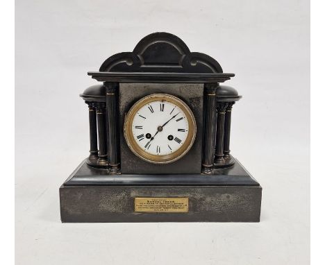Early 20th century slate mantel clock, the circular enamel dial with Roman numerals denoting hours, flanked on either side by
