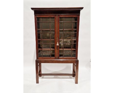Early 20th century stained wooden glazed cabinet&nbsp;on stand, with astragal cupboards enclosing four shelves, on straight s
