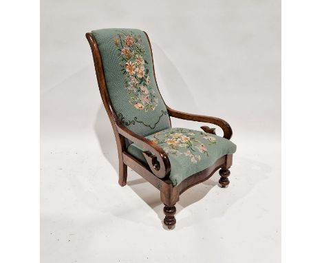 Victorian mahogany open armchair with padded back and stuffover seat in floral woolwork tapestry, having scroll arms and turn