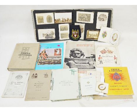 Vintage suitcase containing an assortment of ephemera, to include an early 20th century family photograph album, 1930's dinne