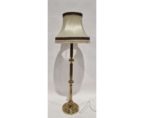 Modern brass standard lamp, of ribbed cylindrical form with interspersed sphere's, approximately 130cm high excluding fitting