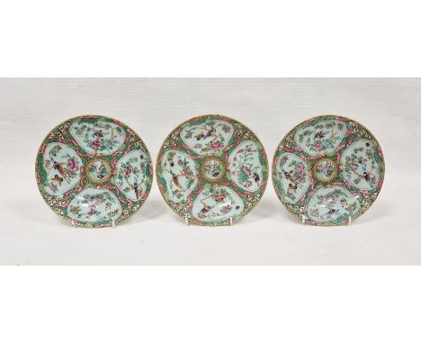 Three Canton famille rose small circular plates, 19th century, blue seal marks to reverse, each painted with panels of birds,