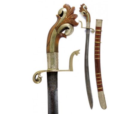 dating: 19th Century provenance: Kalimantan, Curved, single-and false-edged blade with fuller, tang with brass-inlaid inscrip