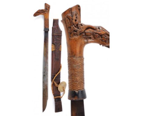 dating: circa 1900 provenance: Kalimantan, Single-edged blade of typical shape. Wooden hilt, slightly embossed, base covered 