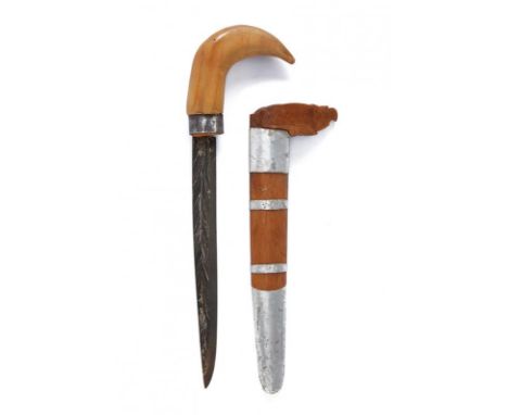 dating: 20th Century provenance: Sulawesi, Fine, single-edged blade, in pamor. Wooden, curved grip with iron ring-nut. Wooden