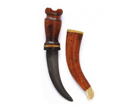 dating: 19th Century provenance: Sulawesi, Curved, double-edged blade. Wooden grip, embossed and decorated with bone and horn