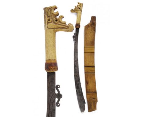 dating: early 20th Century provenance: Kalimantan, Slightly curved, single-edged blade, chiselled and pierced on the back at 