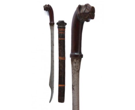 dating: 19th Century provenance: Nias, Long, single-edged blade with hollow tip. Angled, wooden, embossed grip. Wooden scabba