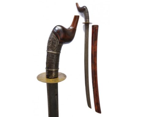 dating: 19th Century provenance: Indonesia, Curved, single-edged blade, in pamor. Round, thin, brass quillon. Fine, wooden, e