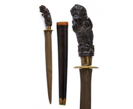 dating: 20th Century provenance: Giava, Straight, single-and false-edged blade. Wooden (Bali) grip, embossed with a deity. Br