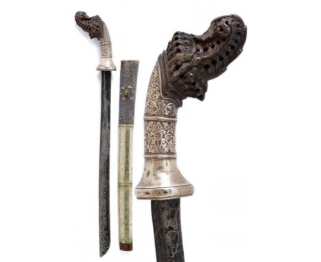 dating: early 20th Century provenance: Sumatra, Straight, single-edged blade, in fine pamor. Horn hilt, richly pierced and em