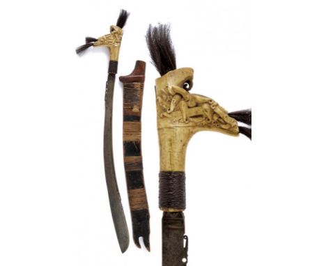 dating: early 20th Century provenance: Kalimantan, Slightly curved, single-edged blade, chiselled and pierced on the back at 