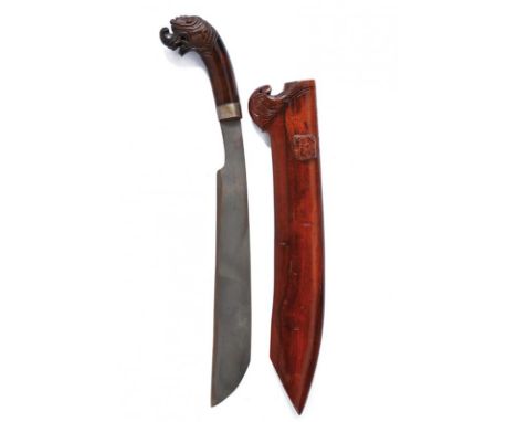 dating: 20th Century provenance: Giava, Heavy, iron, single-edged blade. Wooden grip, embossed with a dragon's head and with 