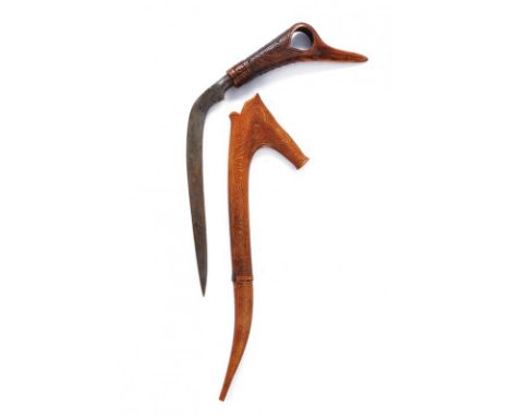 dating: 20th Century provenance: Sumatra, Curved, single-edged blade, wooden grip, embossed with a bird's head. Wooden, engra