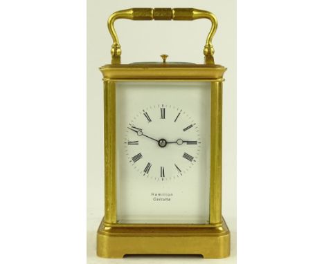 A French brass cased 8-day carriage clock with repeat movement, retailers Hamilton of Calcutta, case height 12.5cm.