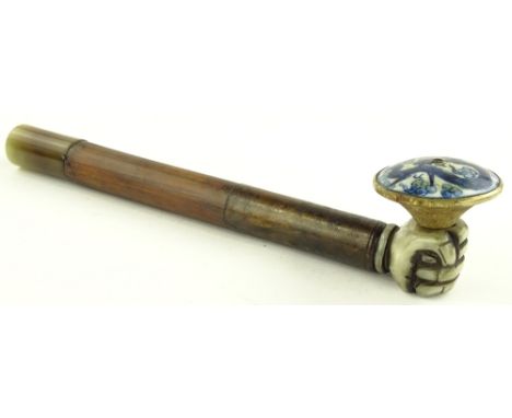 A Chinese ceramic and stained wood opium pipe with jade mouthpiece, length 31cm.