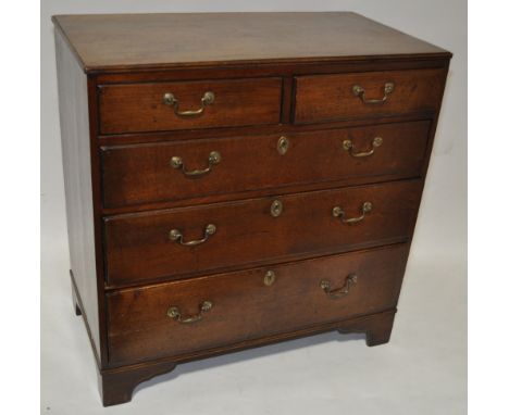 An 18th century oak chest of 2 short and 3 long drawers on bracket feet, width 2'11", height 2'11", depth 1'6".
