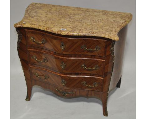 A Kingwood walnut and marquetry decorated commode of serpentine form, with shaped marble top, 3 long drawers and ormolu mount