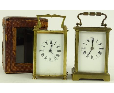 A brass cased carriage clock, dated 1918 in leather travelling case together with another French brass carriage clock, (2).