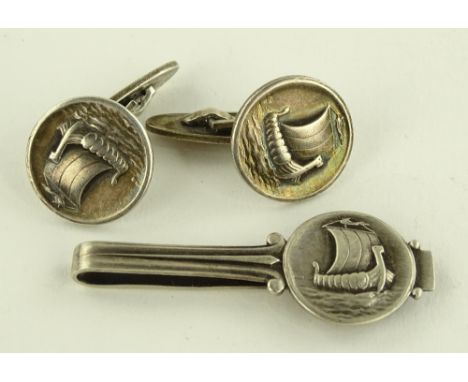 A pair of Georg Jensen silver Viking ship design cufflinks and matching tie clip.