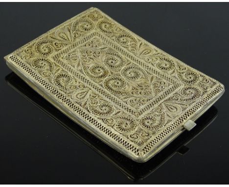 An ornate Maltese/Portuguese unmarked silver filigree cigarette case, 4.95 oz, length 11cm.